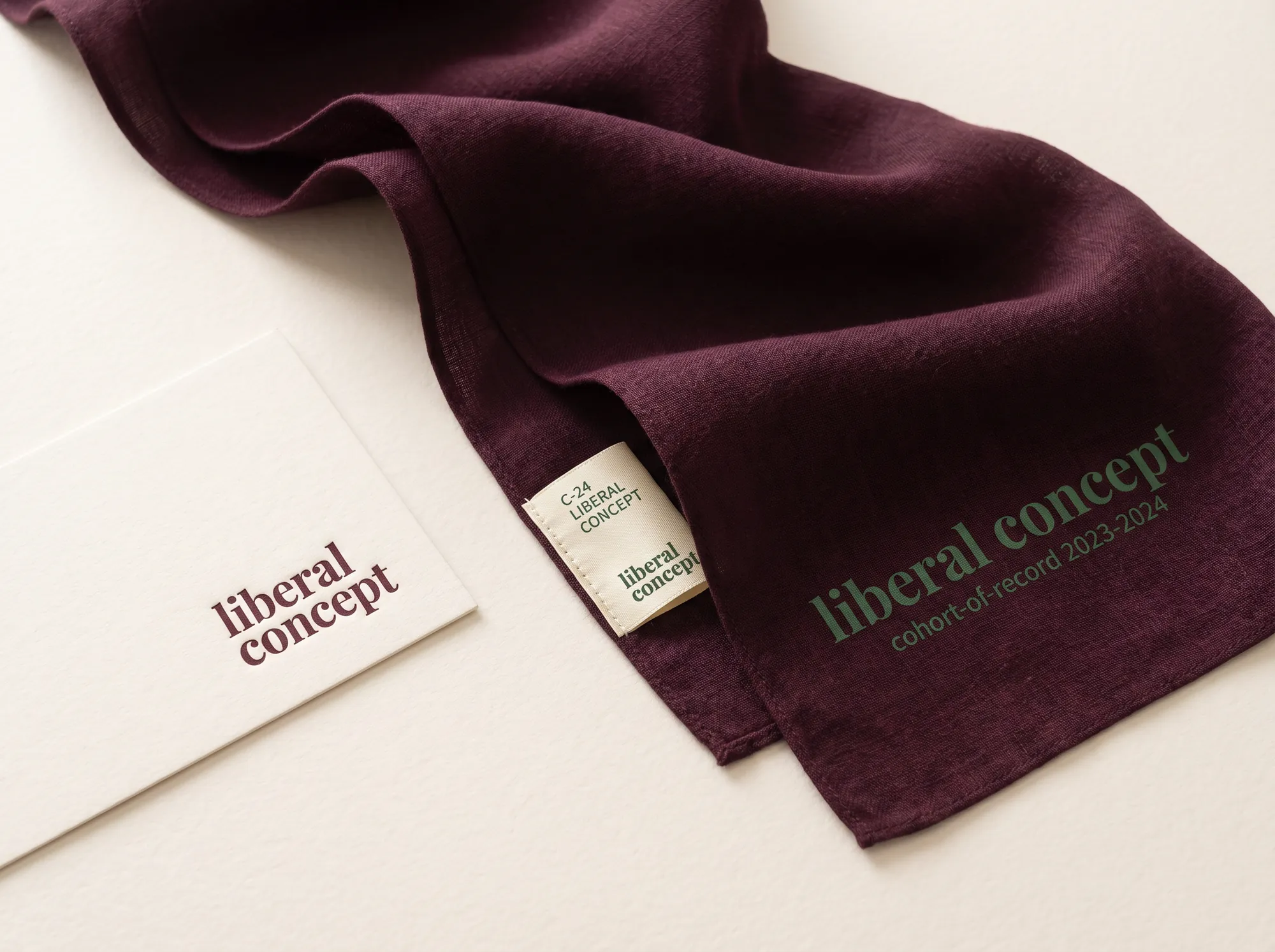Liberal Concept Cohort Silk Scarf (Adult Liberal Arts) — A long hand-loomed silk scarf in deep wine with the wordmark hand-printed in forest green at one end — a working accessory issued to working term members at the working capstone seminar.