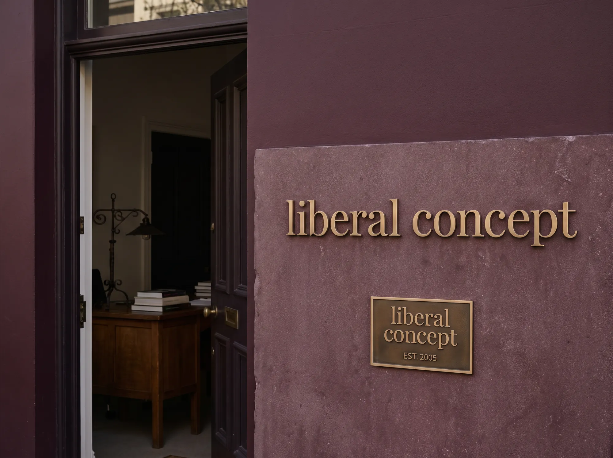 Liberal Concept Advisory Door Plaque (Philanthropic & Endowment Advisory) — A working philanthropic-advisory office door plaque cast in solid bronze on a deep-wine limestone slab, mounted at the working advisory doorway beside the working foundation desk.