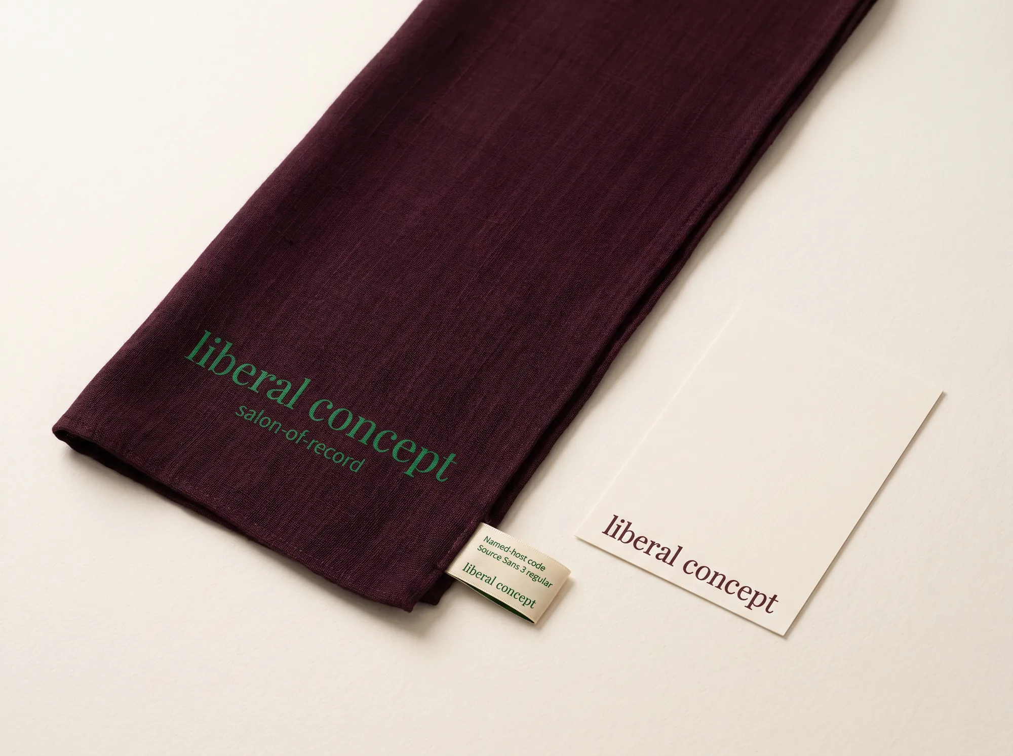 Liberal Concept Salon Silk Scarf (Private Members' Salons) — A long hand-loomed silk salon scarf in deep wine with the wordmark hand-printed in forest green at one end — a working accessory issued to working salon members and named hosts at the working visiting evening.